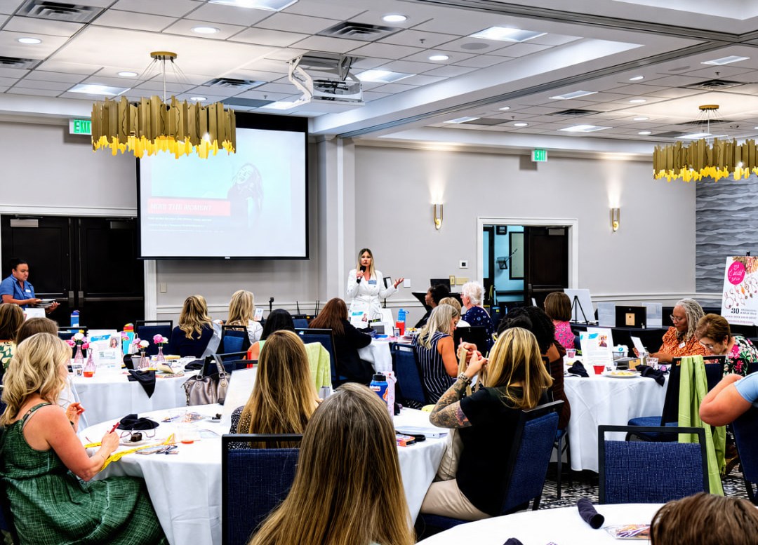 A full room listening to Andrea Merrill speak
